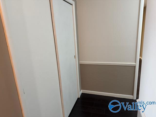 2500 Montezuma Dr, Gadsden, AL 35904 - corridor with dark wood finished floors and baseboards