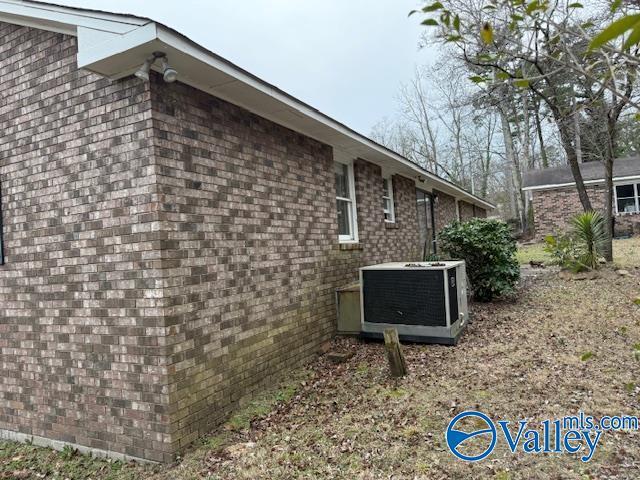 2500 Montezuma Dr, Gadsden, AL 35904 - view of side of property featuring central AC unit and brick siding