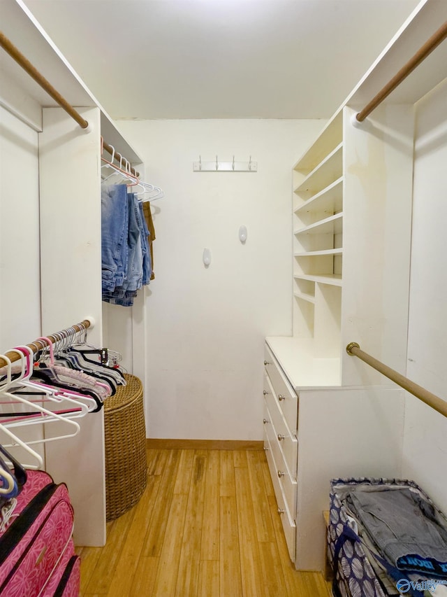 walk in closet featuring light hardwood / wood-style floors