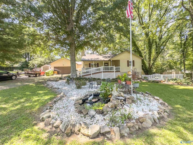 view of yard with an outdoor structure, a deck, and a garage