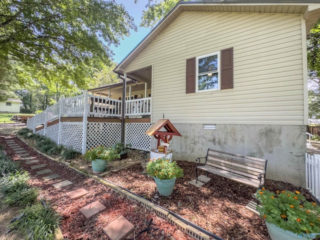 back of property with a wooden deck