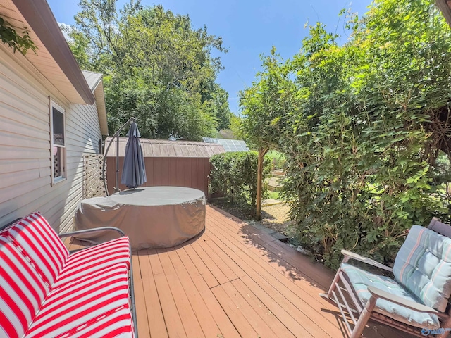 wooden terrace with a hot tub