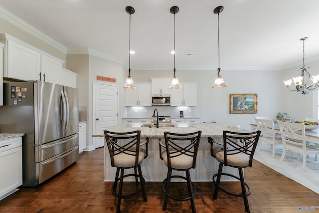 kitchen featuring appliances with stainless steel finishes, dark wood-type flooring, and white cabinets