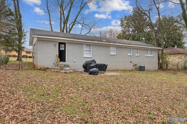 2217 Linde St, Huntsville, AL 35810 - back of property featuring central AC unit and brick siding