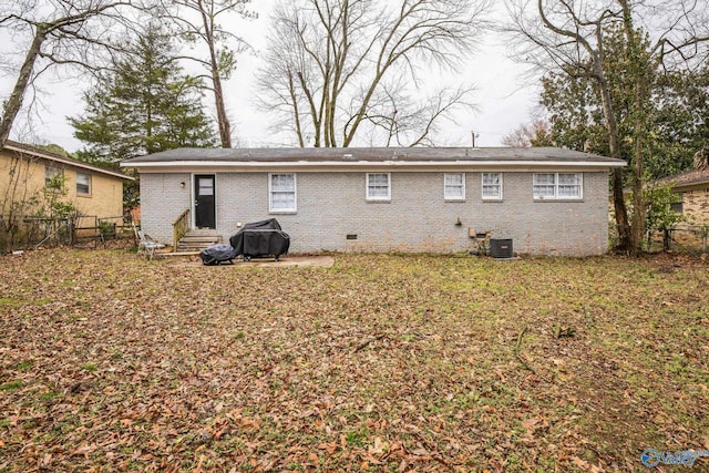 2217 Linde St, Huntsville, AL 35810 - rear view of house featuring entry steps, crawl space, brick siding, and central AC