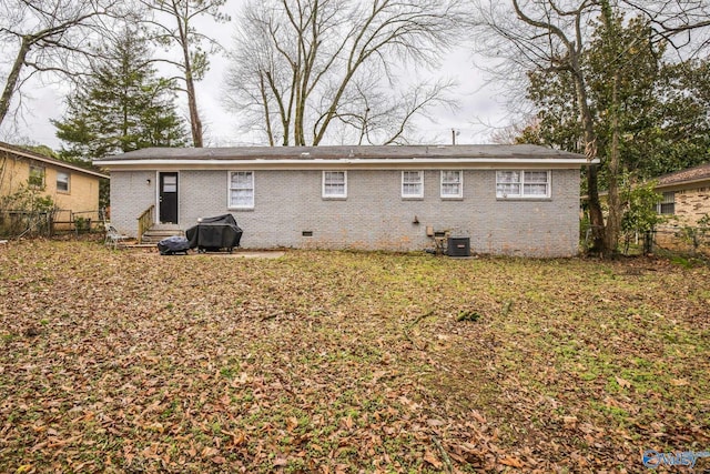2217 Linde St, Huntsville, AL 35810 - back of house featuring crawl space, cooling unit, entry steps, and brick siding