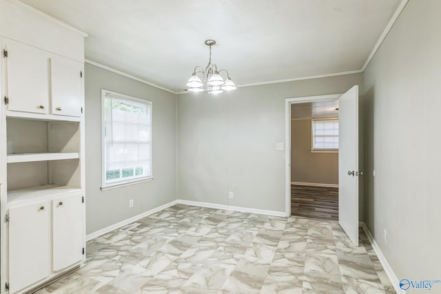 2217 Linde St, Huntsville, AL 35810 - unfurnished dining area featuring healthy amount of natural light, ornamental molding, light marble finish flooring, a chandelier, and baseboards