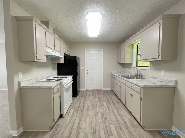 160 Guy Wilson Rd, Hazel Green, AL 35750 - kitchen featuring light wood-style flooring, a textured ceiling, under cabinet range hood, electric stove, and a sink