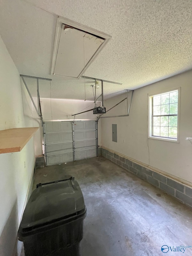 160 Guy Wilson Rd, Hazel Green, AL 35750 - garage with electric panel and a garage door opener
