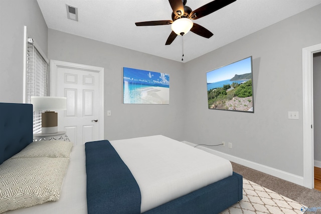 carpeted bedroom featuring ceiling fan