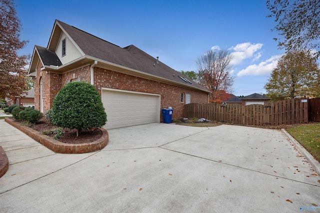 view of side of property with a garage