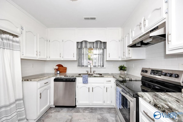 1503 Cedarwood Cir, Huntsville, AL 35803 - kitchen with appliances with stainless steel finishes, under cabinet range hood, a sink, white cabinetry, and decorative backsplash