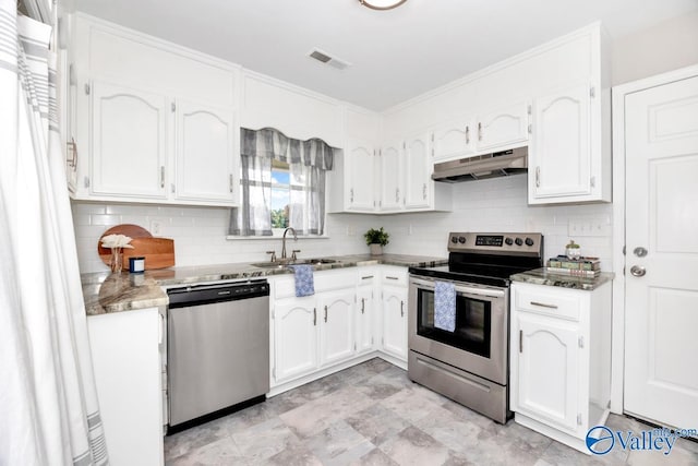 1503 Cedarwood Cir, Huntsville, AL 35803 - kitchen featuring stainless steel appliances, under cabinet range hood, white cabinets, tasteful backsplash, and ornamental molding