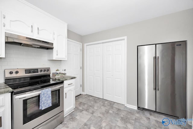 1503 Cedarwood Cir, Huntsville, AL 35803 - kitchen featuring appliances with stainless steel finishes, under cabinet range hood, white cabinetry, and decorative backsplash