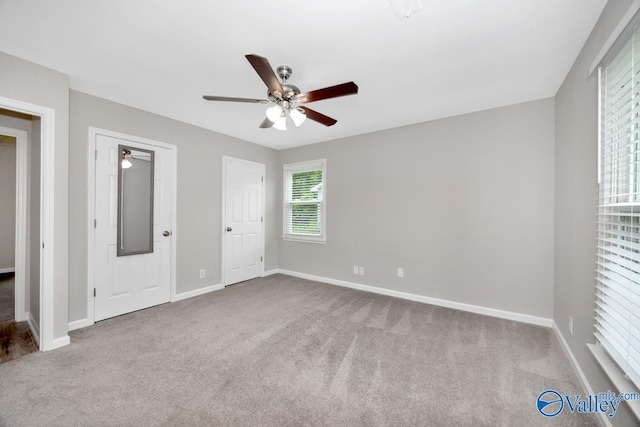 1503 Cedarwood Cir, Huntsville, AL 35803 - unfurnished bedroom with carpet flooring, baseboards, and a ceiling fan