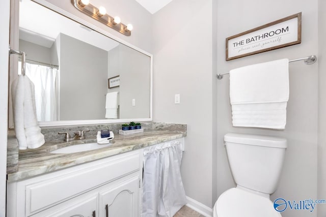 1503 Cedarwood Cir, Huntsville, AL 35803 - bathroom featuring toilet, vanity, and baseboards