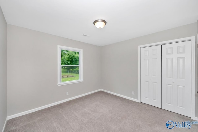 1503 Cedarwood Cir, Huntsville, AL 35803 - unfurnished bedroom featuring carpet floors, baseboards, and a closet