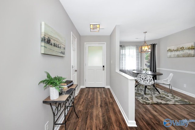 1503 Cedarwood Cir, Huntsville, AL 35803 - foyer with baseboards, dark wood finished floors, and a chandelier