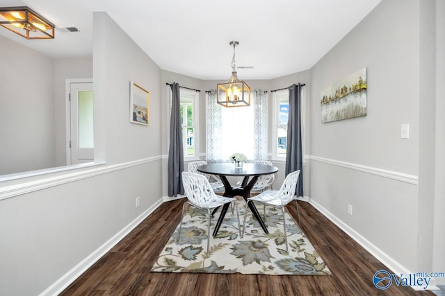1503 Cedarwood Cir, Huntsville, AL 35803 - dining room with a chandelier, dark wood finished floors, and baseboards