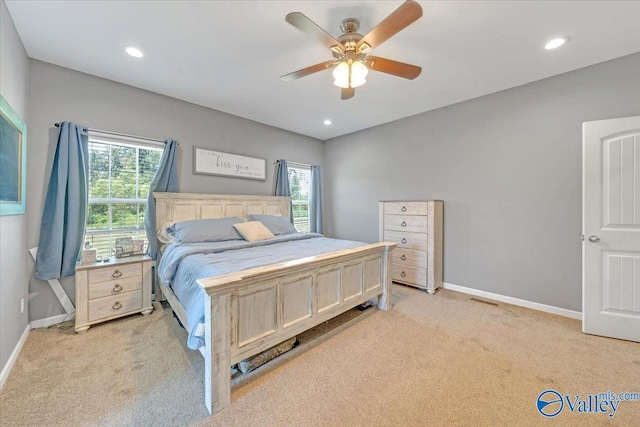bedroom with light carpet, baseboards, a ceiling fan, and recessed lighting