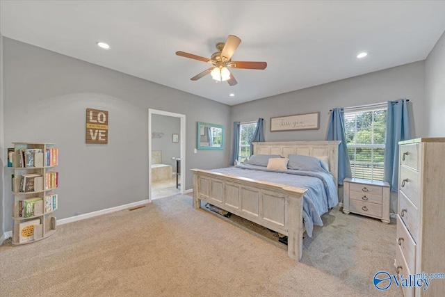 bedroom with baseboards, visible vents, light colored carpet, ensuite bathroom, and recessed lighting