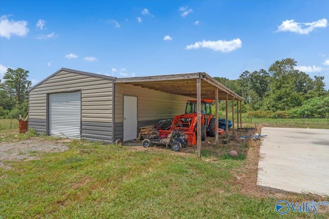 view of outbuilding featuring an outdoor structure and driveway
