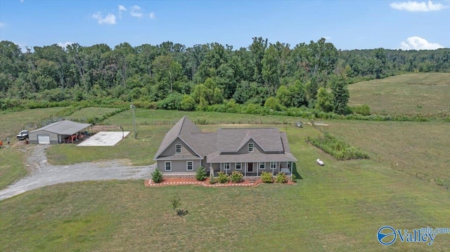 birds eye view of property with a rural view and a view of trees