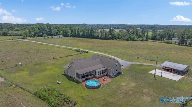birds eye view of property with a rural view