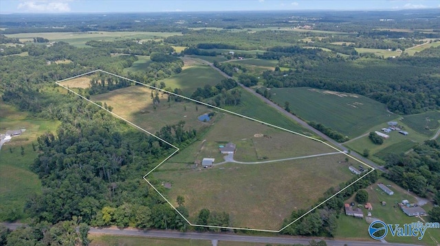birds eye view of property with a rural view