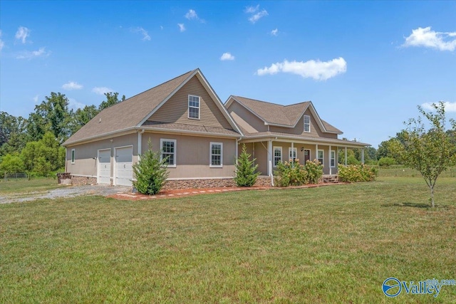 view of front of property with driveway, a front yard, and stucco siding