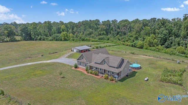 drone / aerial view with a rural view and a wooded view
