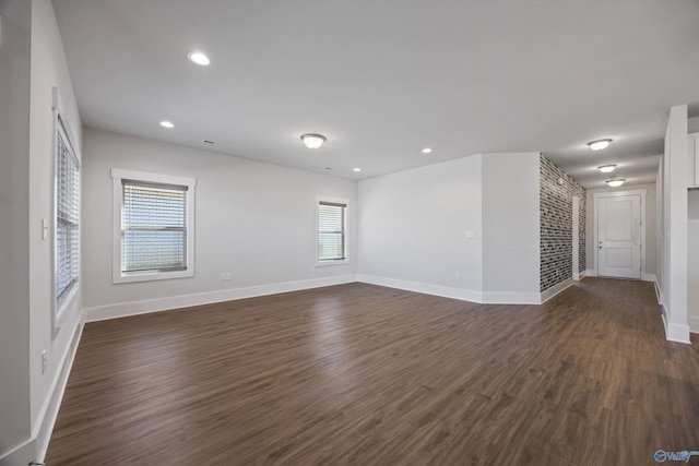 spare room with dark hardwood / wood-style flooring