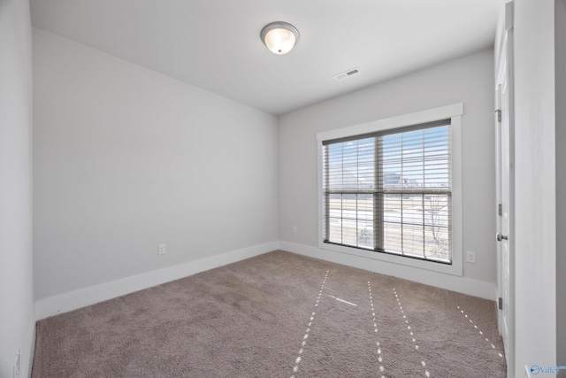 spare room with carpet flooring