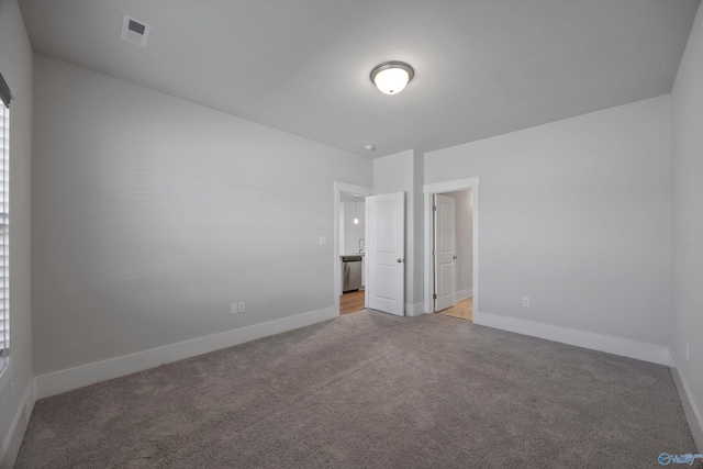 unfurnished bedroom featuring carpet flooring