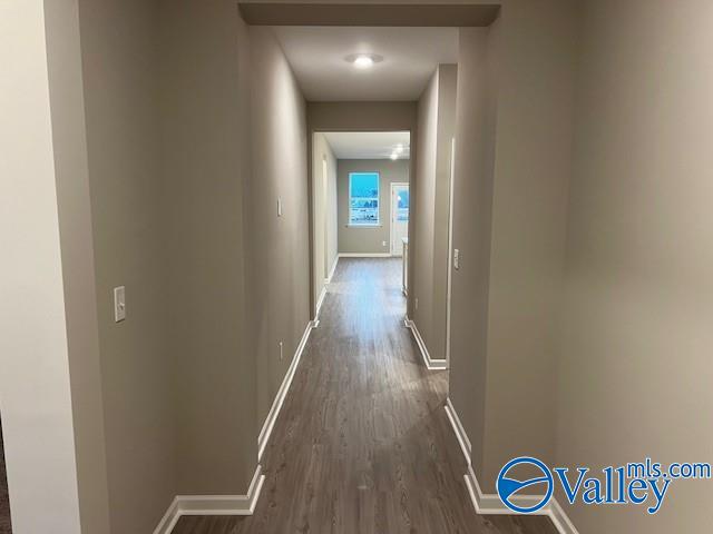 hall featuring dark wood-type flooring