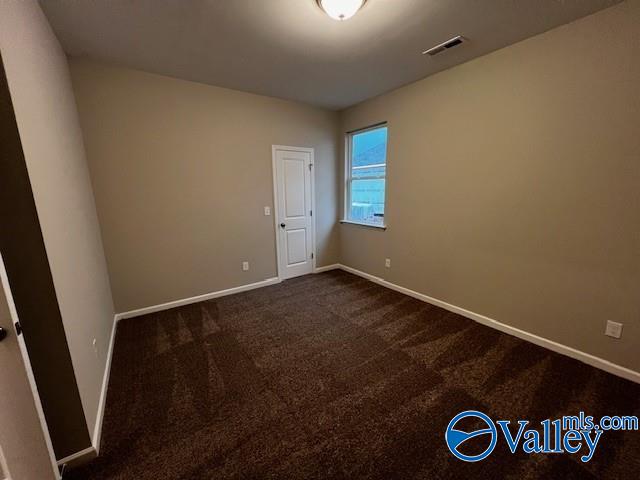 empty room featuring carpet floors