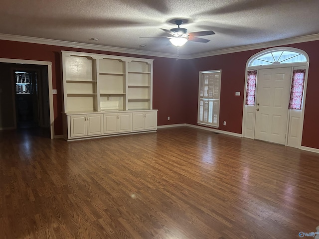 unfurnished living room with crown molding, ceiling fan, dark hardwood / wood-style flooring, and a textured ceiling