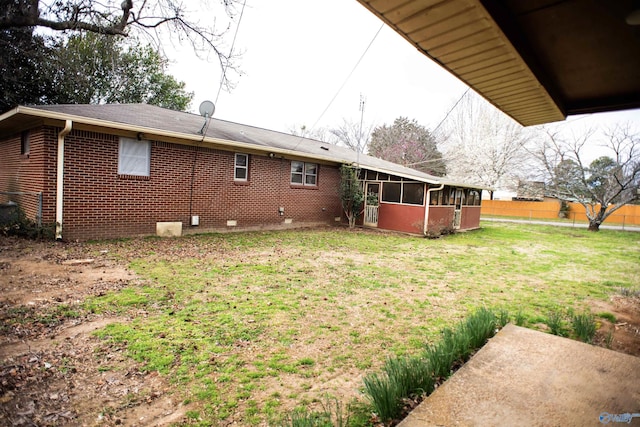 view of yard with a sunroom