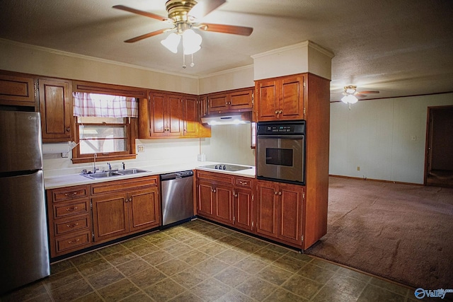 kitchen with under cabinet range hood, stainless steel appliances, light countertops, and a sink