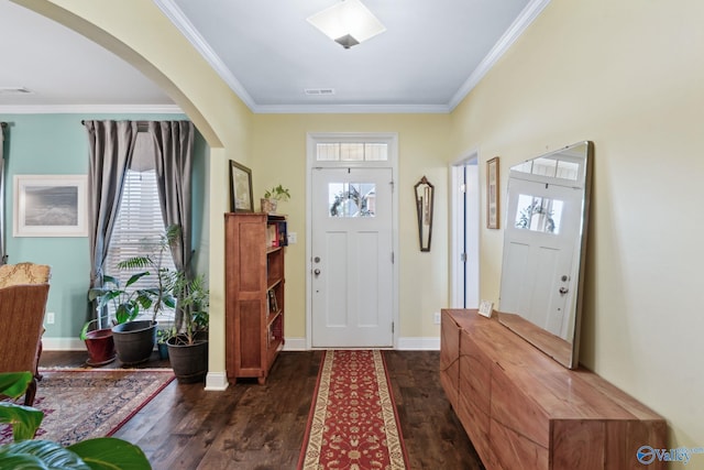 entrance foyer with dark wood-type flooring and ornamental molding