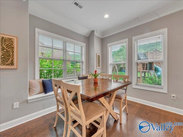 dining room featuring crown molding, recessed lighting, baseboards, visible vents, and dark wood-style floors
