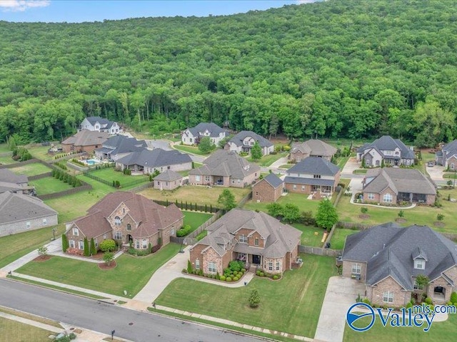 bird's eye view with a residential view and a wooded view