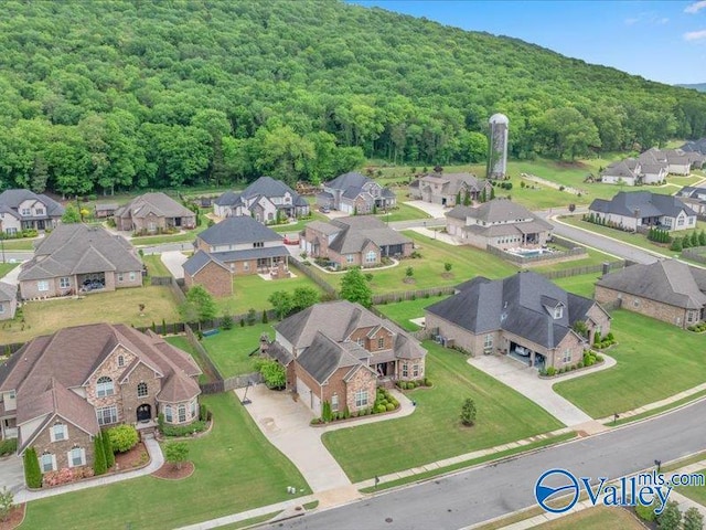aerial view featuring a view of trees and a residential view