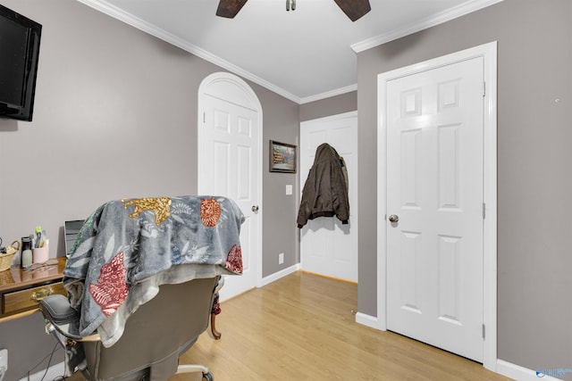 office featuring ceiling fan, ornamental molding, and wood-type flooring