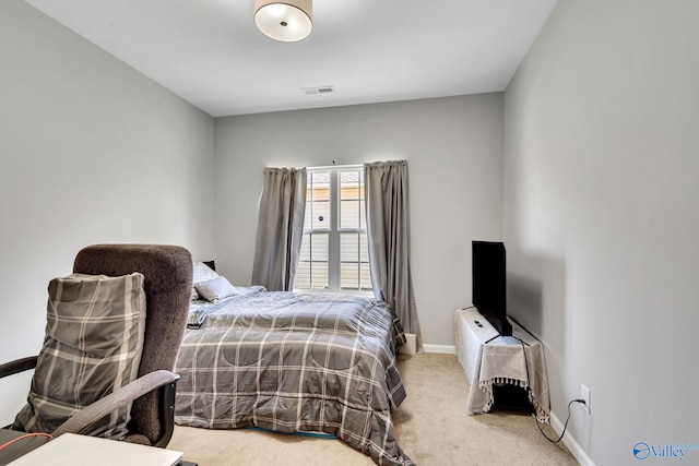 bedroom featuring baseboards, carpet floors, and visible vents
