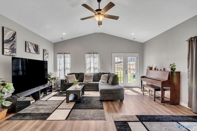 living room featuring french doors, wood finished floors, vaulted ceiling, and ceiling fan