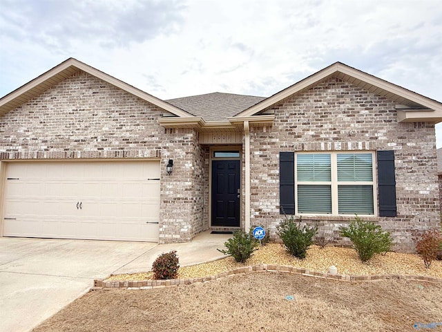 ranch-style home with an attached garage, brick siding, driveway, and a shingled roof