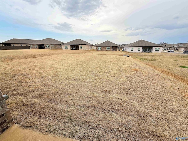 view of yard featuring a residential view