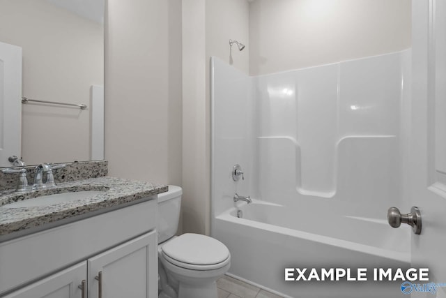 full bathroom featuring toilet, shower / washtub combination, vanity, and tile patterned floors