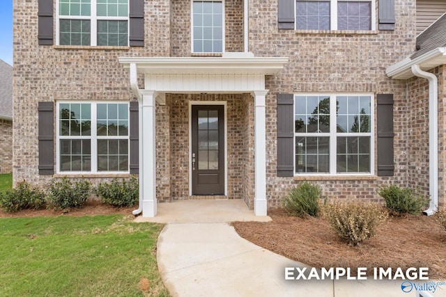 entrance to property with a yard